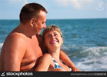middleaged portrait of pair against sea