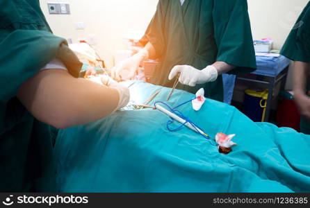Midsection of surgery team operating Medical Team Performing Surgical Operation in Modern Operating Roomor Group of surgeons in operating room with surgery equipment.
