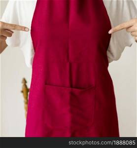 midsection view woman pointing finger red apron . Resolution and high quality beautiful photo. midsection view woman pointing finger red apron . High quality and resolution beautiful photo concept