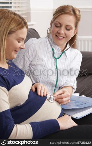 Midwife Making Home Visit To Expectant Mother