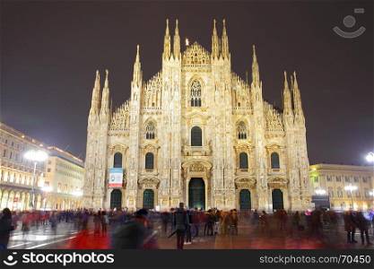 Milan Cathedral (Duomo di Milano) at night, Italy (People in motion blur)
