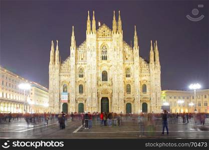 Milan Cathedral (Duomo di Milano) at night, Italy (People in motion blur)