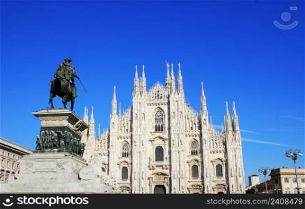 Milan Cathedral or Duomo di Milano and monument to Victor Emmanuel II in Milan, Italy .. Milan Cathedral or Duomo di Milano and monument to Victor Emmanuel II in Milan, Italy