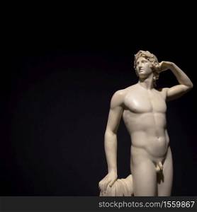 MILAN, ITALY - June 2020: the ancient sculpture Apollo Crowing Himself - 1782 - Antonio Canova&rsquo;s masterpiece. Intesa Italian Museum.