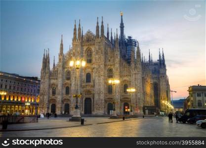MILAN, ITALY - NOVEMBER 25: Duomo cathedral with people early in the morning on November 25, 2015 in Milan, Italy.