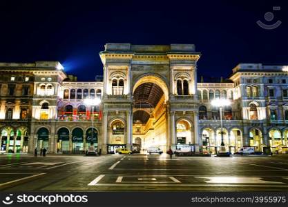 MILAN, ITALY - NOVEMBER 25: Galleria Vittorio Emanuele II shopping mall entrance with people early in the morning on November 25, 2015 in Milan, Italy.
