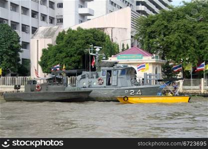 Military boats on the Chao Phraya river in Bangkok, Thailand