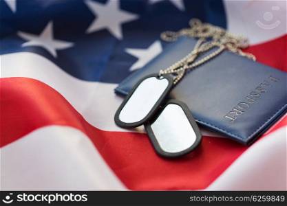 military forces, patriotism, recruitment and national service concept - close up of american flag, passport and military badge