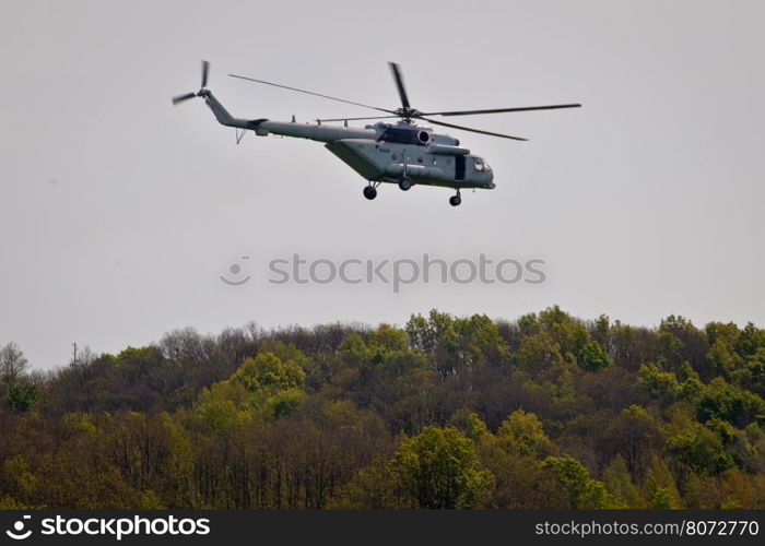 Military helicopter above forest view, Mi-8 transponter