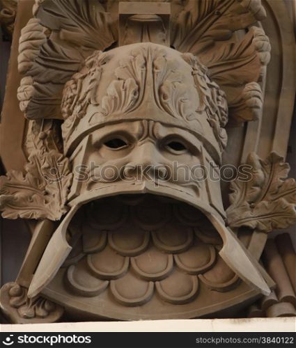 military heraldic mask bas relief