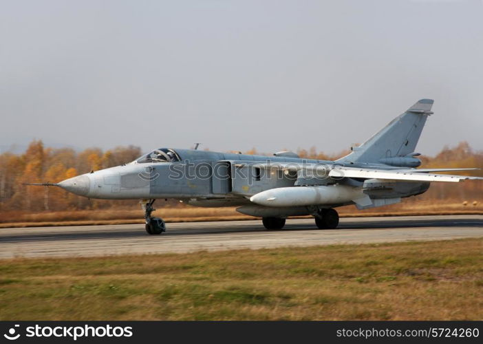 Military jet bomber airplane Su-24 Fencer on take off and landing