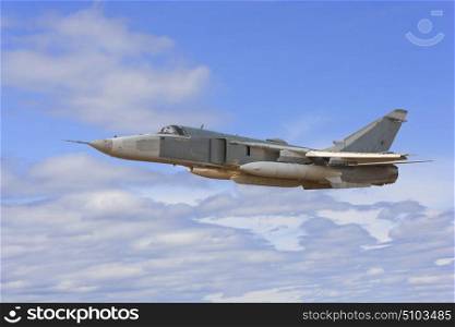 Military jet bomber Su-24 Fencer flying above the clouds.. Military jet bomber Su-24 Fencer flying above the clouds