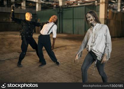 Military man nightmare, battle with zombie army in abandoned factory. Horror in city, creepy crawlies, doomsday apocalypse, bloody evil monsters. Military man nightmare, battle with zombie army