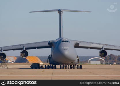 Military plane of transportation of materials and people. Transporting airplane