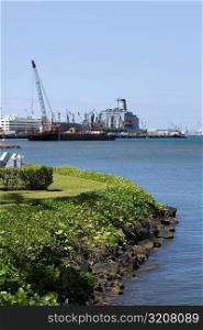 Military ship and a crane at a commercial dock, Pearl Harbor, Honolulu, Oahu, Hawaii Islands, USA