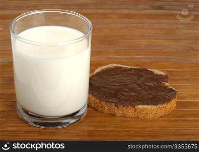 milk and a sandwich with peanut butter