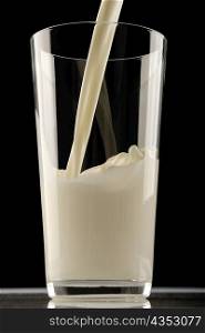 Milk being poured in a glass
