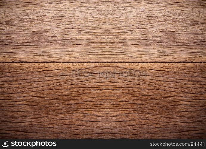 Milk bottle on brown wooden background. Top view with copy space.