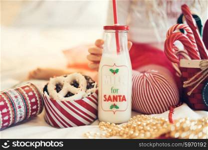 Milk for santa in a jar with christmas pretzels