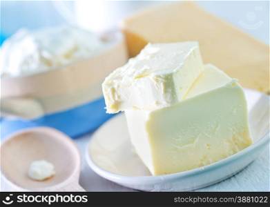 milk products on a table, butter and milk