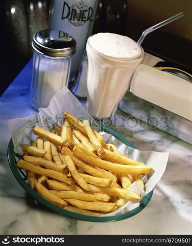 Milk shake and a plate of French fries