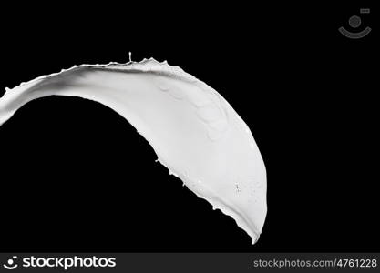 milk splash. White milk splash isolated on black background