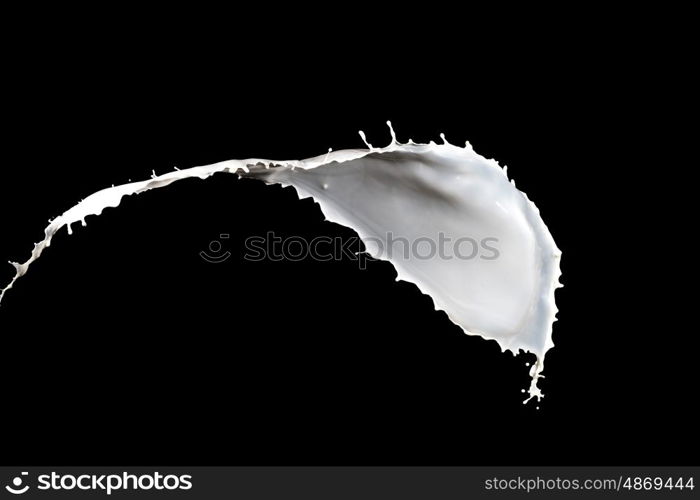 milk splash. White milk splash isolated on black background