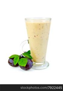 Milkshake in a glass, black plum with green leaves isolated on white background