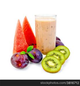 Milkshake in high glass beaker with plums, kiwi and watermelon isolated on white background