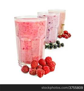 Milkshakes with black currant, cherry, raspberry in glass jars isolated on white background