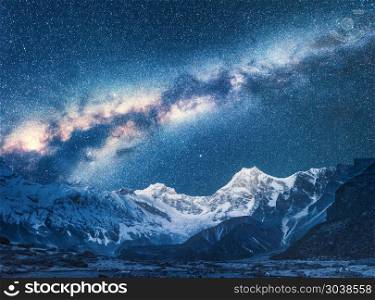 Milky Way and Beautiful Manaslu, Himalayas. Amazing view with himalayan mountains and starry sky at night in Nepal. High rocks with snowy peak and sky with stars. Night landscape with bright milky way. Milky Way and Beautiful Manaslu, Himalayas. Space