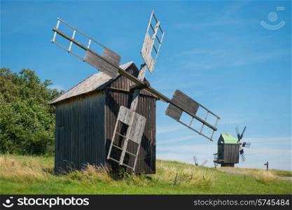Mill on the wheat field with blue sky