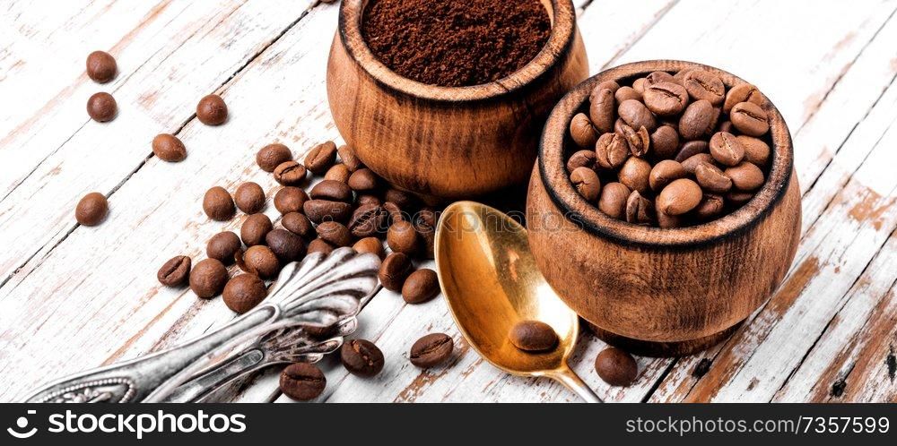 Milled coffee powder with beans.Coffee beans and ground coffee. Coffee beans and grounds