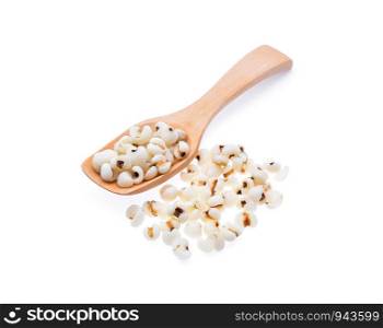 Millet grains in wooden spoon isolated on white background