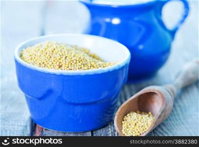 millet porridge in bowl and on a table