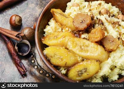 Millet porridge with bananas and nuts.Healthy breakfast. Millet porridge with banana