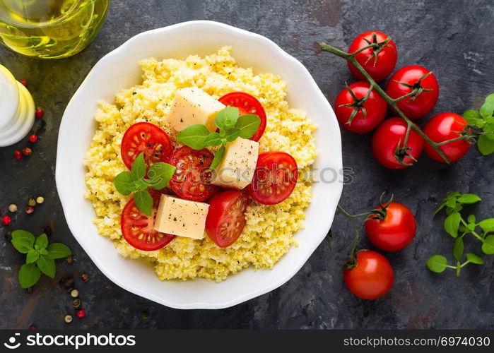 Millet porridge with tomatoes and cheese