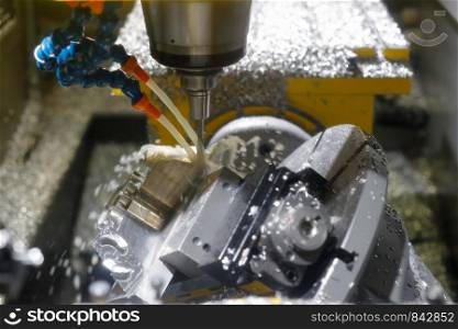 Milling metalworking process by CNC vertical milling center. Selective focus.