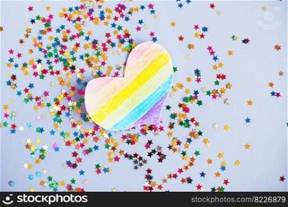 milticolored sequins and lgtb flag in the form of a heart. concept of a lgbt holiday.. milticolored sequins and lgtb flag in the form of a heart. concept of a lgbt holiday