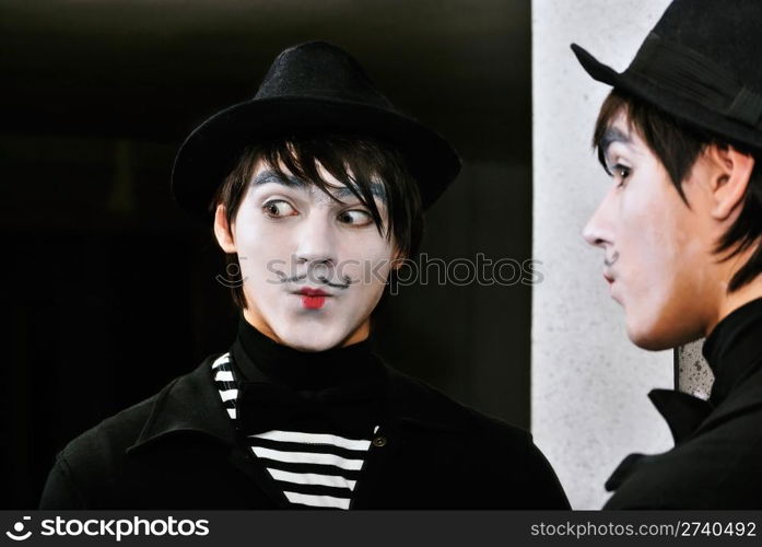 mime actor at a mirror. Close-up