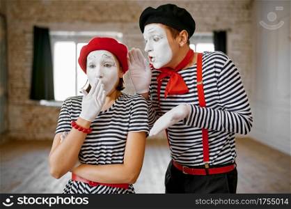 Mime artists, gesture scene, parody comedy. Pantomime theater, comedian, positive emotion, humour performance, funny face mimic and grimace. Mime artists, gesture scene, parody comedy