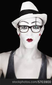 Mime in white hat and glasses on black background