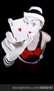 Mime in white hat showing ace of hearts closeup