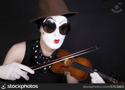 mime with violin and sunglasses on black background