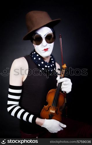 mime with violin and sunglasses on black background