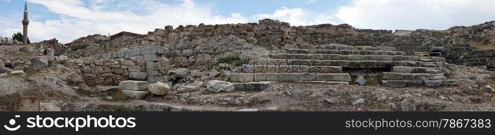 Minaret and ruins of ancient theater in Pessinus, Turkey