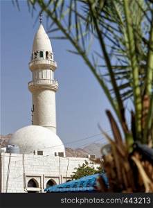 Minaret of a small mosque in a suburb of the port city Aqaba in Jordan, middle east