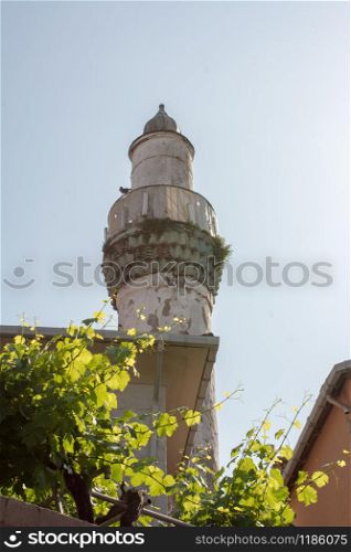Minaret of Muslim mosque Religion, islam, tourism and travel concepts
