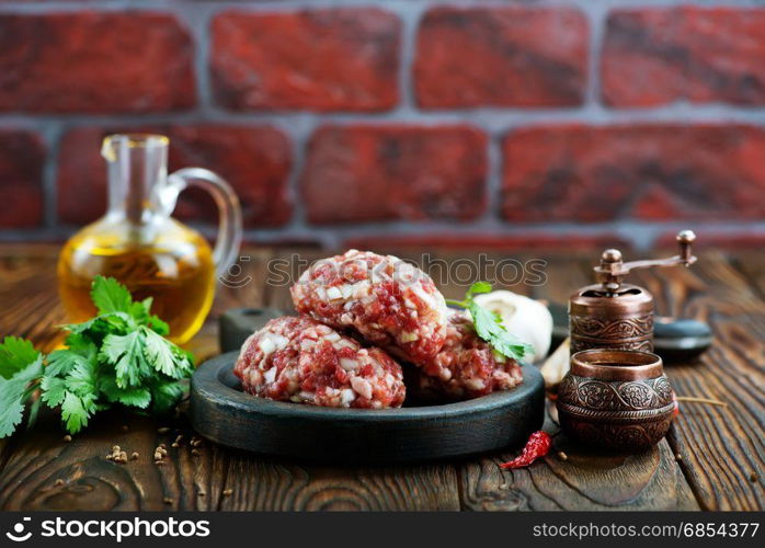 minced meat with salt and spice on a table