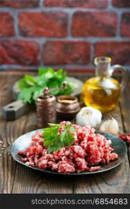 minced meat with salt and spice on a table